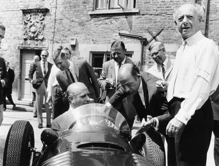 Framed Print : Juan Manuel Fangio at the wheel of a V16 BRM, (1960s?) Framed Print : Juan Manuel Fangio at the wheel of a V16 BRM, (1960s?)