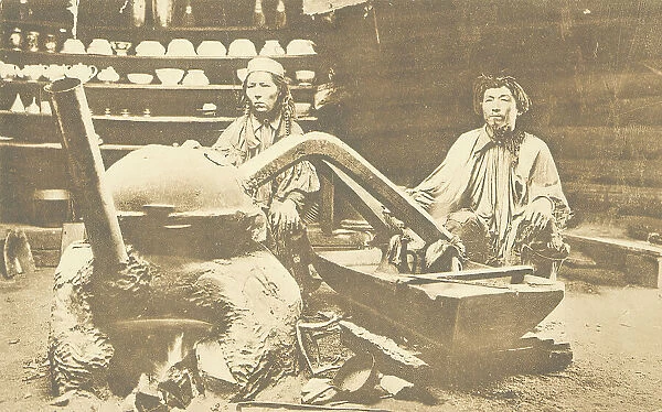 In a Kachin yurt. While preparing 'araga' (wine), 1904-1917. Creator: Unknown. In a Kachin yurt. While preparing 'araga' (wine), 1904-1917. Creator: Unknown