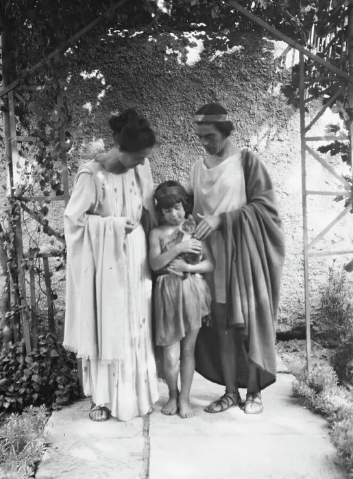 Framed Print : Kanellos, Vanellos and Tanagra, and child holding a cat, in dance costumes, 1929 Creator: Arnold Genthe Framed Print : Kanellos, Vanellos and Tanagra, and child holding a cat, in dance costumes, 1929 Creator: Arnold Genthe