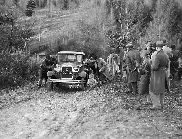 KHL Seatons Ford Model A saloon receiving a push in the Inter-Varsity Trial, 1930