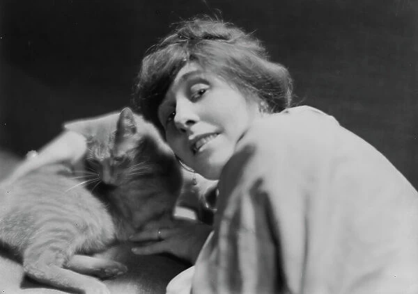 King, Daisy, Miss, with Buzzer the cat, portrait photograph, 1914 June. Creator: Arnold Genthe