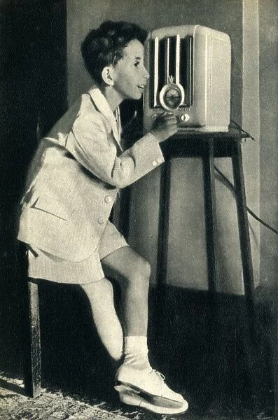 King Faisal of Iraq listening to a broadcast prepared for his birthday by the BBC, 1942