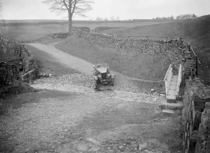 Framed Print : Kitty Brunell road testing a MG 18 / 80, Tan Hill, Yorkshire, April 1931. Artist: Bill Brunell Framed Print : Kitty Brunell road testing a MG 18 / 80, Tan Hill, Yorkshire, April 1931. Artist: Bill Brunell