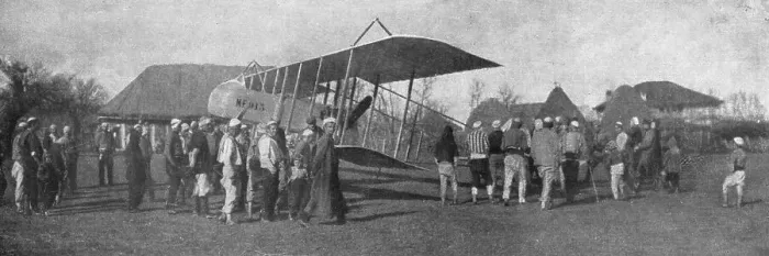 Framed Print : La retraite de nos aviateurs par l'Albanie; Biplan entoure par la population masculine... 1916. Creator: Unknown