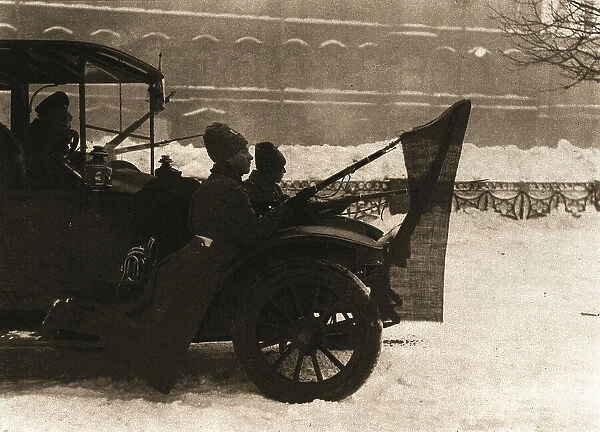La Revolution Russe; Pendant les journees sanglantes: des automobiles remplies de soldats... 1917. Creator: Unknown