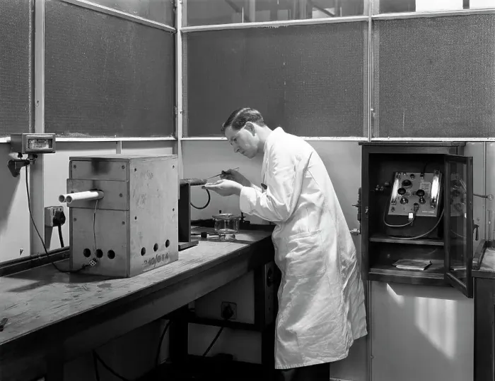 Framed Print : Lab tachnician using a table top test furnace, Sheffield, South Yorkshire, 1962. Artist Framed Print : Lab tachnician using a table top test furnace, Sheffield, South Yorkshire, 1962. Artist