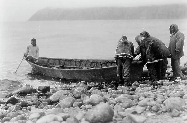 Launching the boat-Little Diomede Island, c1928. Creator: Edward Sheriff Curtis