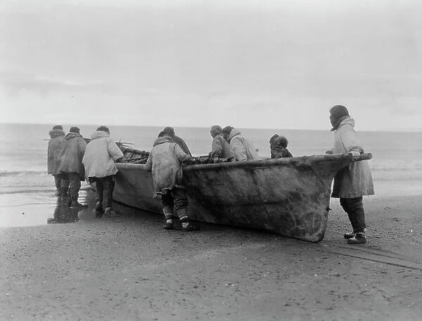 Launching the whale boat-Cape Prince of Wales, c1929. Creator: Edward Sheriff Curtis