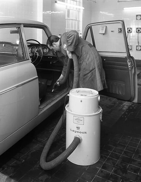 Laycock Vacacar vacuum cleaner in use at an Esso garage, Sheffield, South Yorkshire, 1965