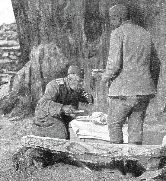 Le commandant d'une des plus fameuses divisions serbes, dejeunant pres de son poste... 1916. Creator: Vladimir Betzitch