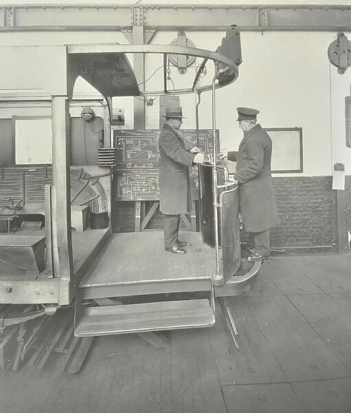 Learner-driver under instruction in a mock-up of tram car cab, London, 1932