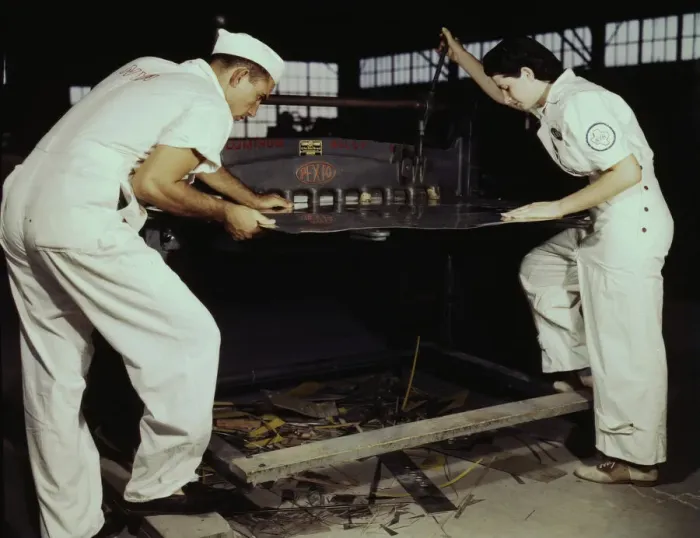 Framed Print : Learning to work a cutting machine, these two NYA employees... Corpus Christi, Texas, 1942. Creator: Howard Hollem Framed Print : Learning to work a cutting machine, these two NYA employees... Corpus Christi, Texas, 1942. Creator: Howard Hollem