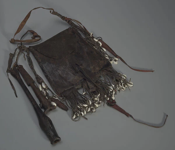 Leather bag with tools, whistles, and shells, 20th Century. Creator: Unknown