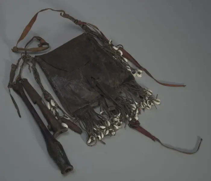 Framed Print : Leather bag with tools, whistles, and shells, 20th Century. Creator: Unknown Framed Print : Leather bag with tools, whistles, and shells, 20th Century. Creator: Unknown
