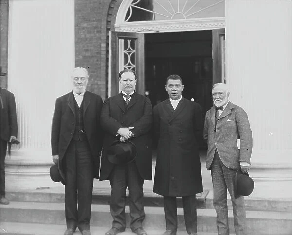 (Left to right) Robert C. Ogden, U.S. Secretary of War William Howard Taft, Booker T... 1906. Creator: Frances Benjamin Johnston