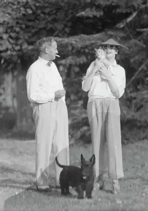 Framed Print : Leonard, Mr. and Mrs. with cat and dog, standing outdoors, between 1926 and 1938. Creator: Arnold Genthe Framed Print : Leonard, Mr. and Mrs. with cat and dog, standing outdoors, between 1926 and 1938. Creator: Arnold Genthe