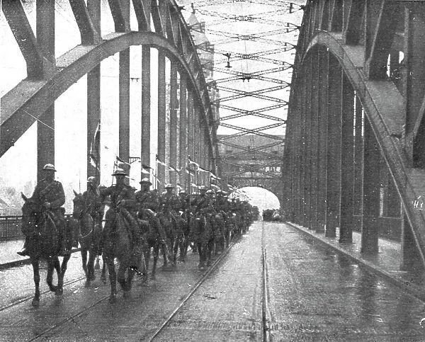 Les Anglais sur le Rhin; A Cologne, Lanciers britanniques passant le Rhin a Cologne... 1918. Creator: Jean Clair-Guyot