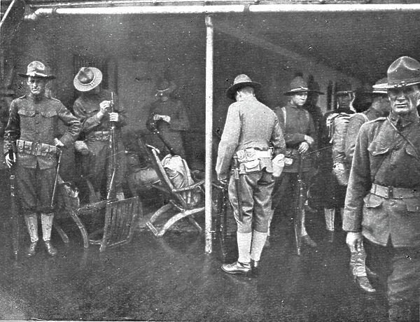 Les Premiers Contingents Americains en France; A bord d'un transport: soldats se preparent... 1917 Creator: Unknown