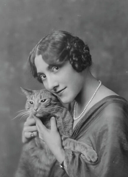 Liebert, M. Miss, with Buzzer the cat, portrait photograph, between 1916 and 1927. Creator: Arnold Genthe