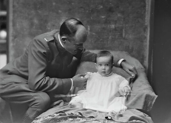 Lieutenant H.B. Stimson and baby, portrait photograph, 1918 May 8. Creator: Arnold Genthe