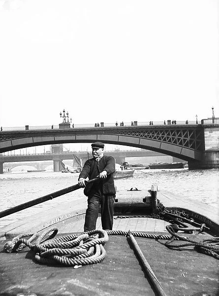Lighter on the Thames going downstream towards Southwark Bridge, London, c1905. Artist