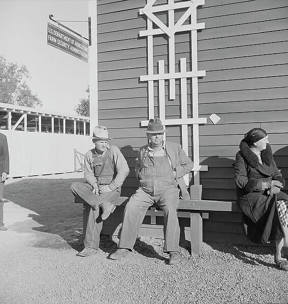 Lineup outside of Farm Security Administration grant office early in the morning, Tulare, CA, 1938. Creator: Dorothea Lange