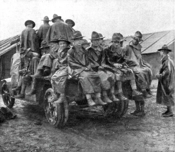 Framed Print : L'Installation en France de L'Avant-Garde Americaine; Un groupe en manteau de pluie... 1917. Creator: Unknown Framed Print : L'Installation en France de L'Avant-Garde Americaine; Un groupe en manteau de pluie... 1917. Creator: Unknown