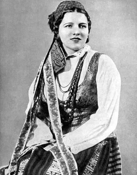 Lithuanian woman in traditional dress, 1936. Artist: Geoffrey L Portham