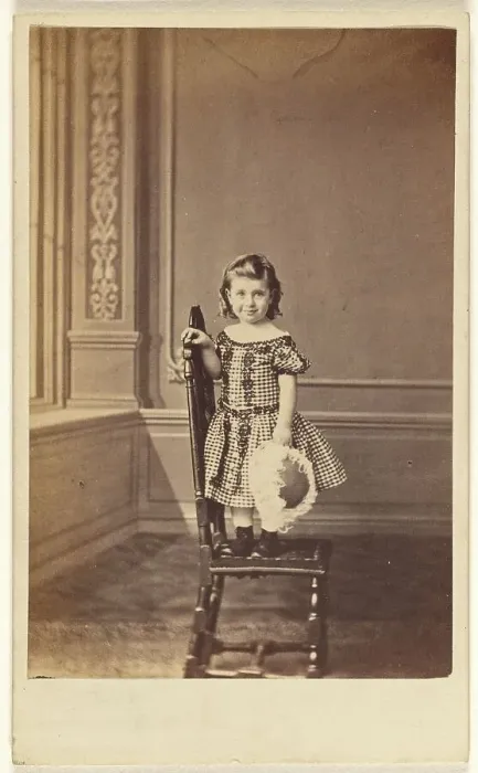 Framed Print : Little girl standing on a chair, 1865-1875. Creator: Frederick Downer & Sons Framed Print : Little girl standing on a chair, 1865-1875. Creator: Frederick Downer & Sons