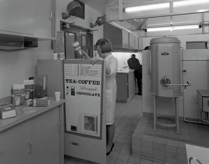 Framed Print : Loading a drinks vending machine at an experimental kitchen in Sheffield, South Yorkshire, 1966 Framed Print : Loading a drinks vending machine at an experimental kitchen in Sheffield, South Yorkshire, 1966
