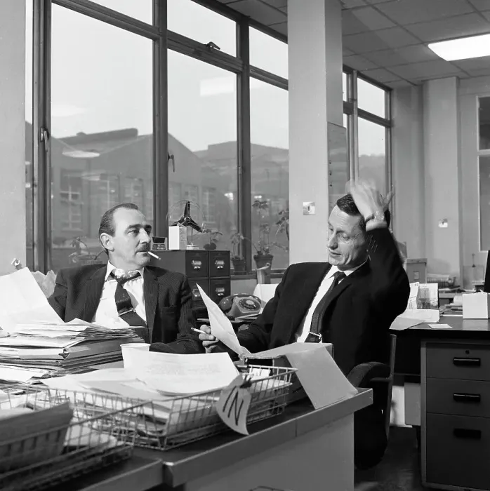 Framed Print : Lost order? two salesmen try to sort out the orders over a cigarette, 1967. Artist Framed Print : Lost order? two salesmen try to sort out the orders over a cigarette, 1967. Artist