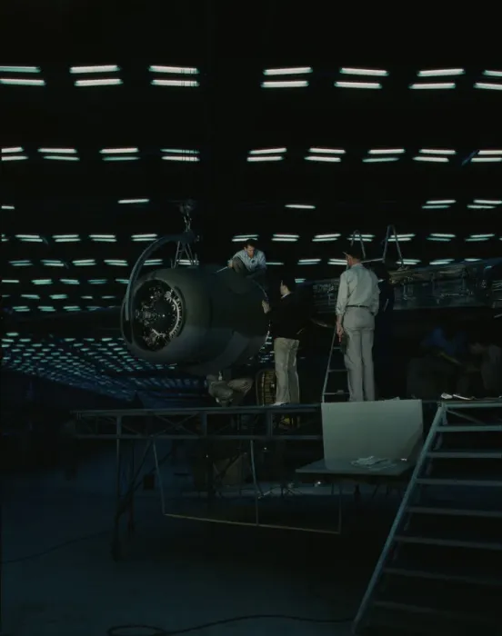 Framed Print : Lowering an engine in place in assembling... Consolidated Aircraft Corp... Fort Worth, Texas, 1942. Creator: Howard Hollem Framed Print : Lowering an engine in place in assembling... Consolidated Aircraft Corp... Fort Worth, Texas, 1942. Creator: Howard Hollem