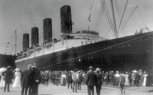 LUSITANIA arriving in N.Y. for first time, Sept. 13, 1907: starboard view; crowd at dock... 1907. Creator: Frances Benjamin Johnston
