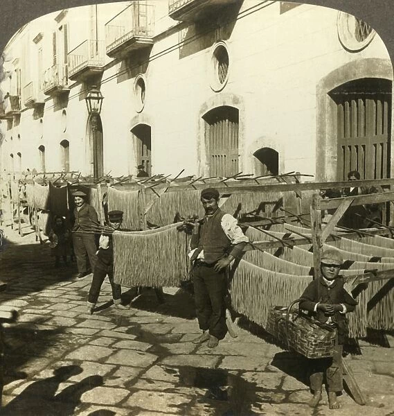 Macaroni drying in the dirty streets of Naples, Italy, c1909. Creator: Unknown
