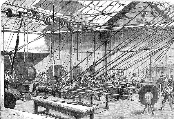 Machines covering with Gutta Percha the Atlantic Cable Wire, at the Gutta Percha Company's... 1857. Creator: Unknown
