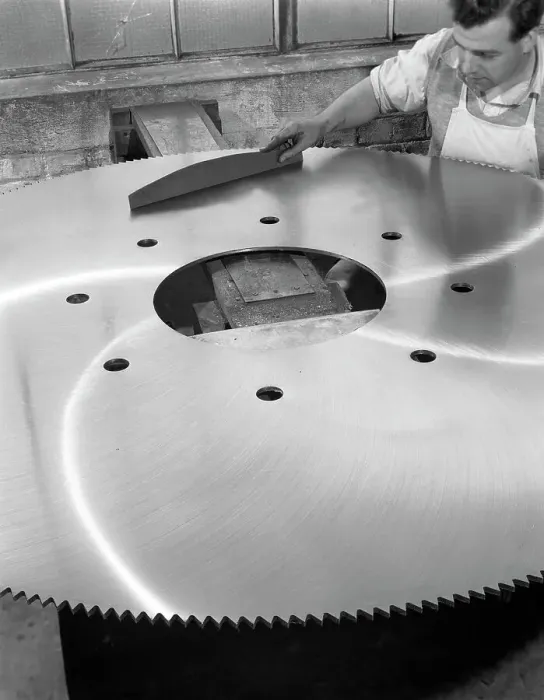 Framed Print : A machinist quality checking a six foot circular saw blade, Sheffield, South Yorkshire, 1963 Framed Print : A machinist quality checking a six foot circular saw blade, Sheffield, South Yorkshire, 1963