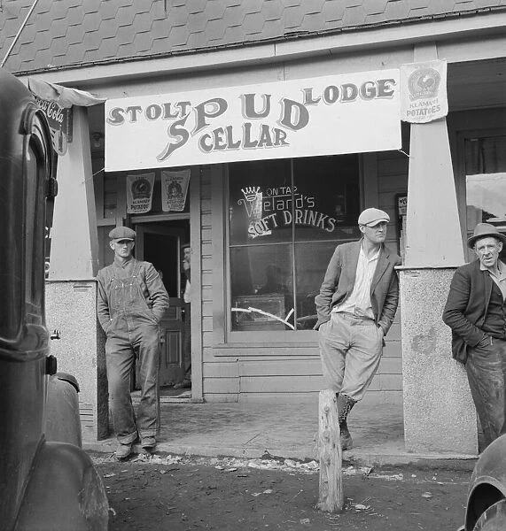 On main street of potato town during harvest season, Merrill, Oregon, 1939. Creator: Dorothea Lange