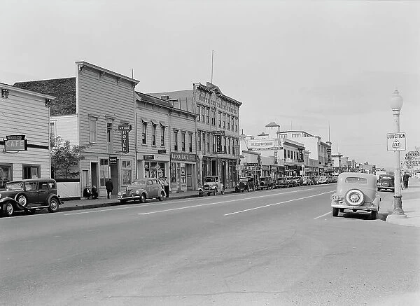 Up the main street of a valley town, Gilroy, California, 1938. Creator: Dorothea Lange