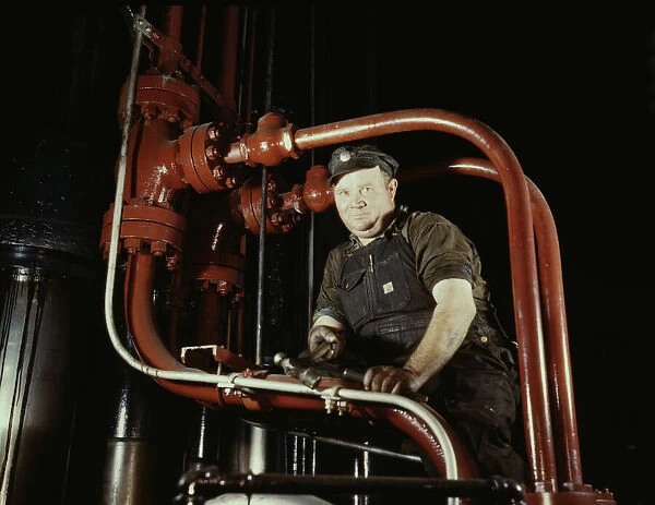 Maintenance mechanic in largest coal press... Combustion Engineering Co. Chattanooga, Tenn. 1942. Creator: Alfred T Palmer