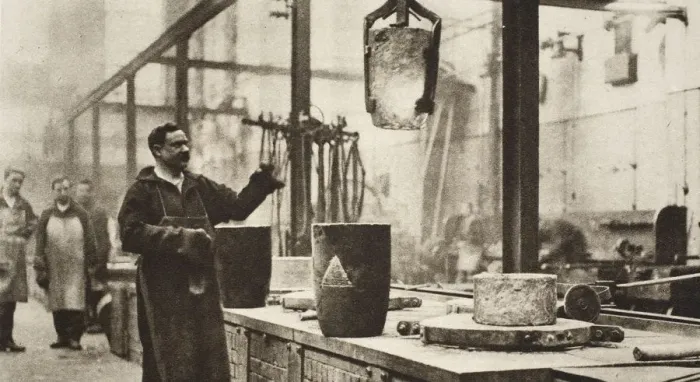 Framed Print : Making money; pots of liquid metal being handled in the melting room, 20th century Framed Print : Making money; pots of liquid metal being handled in the melting room, 20th century
