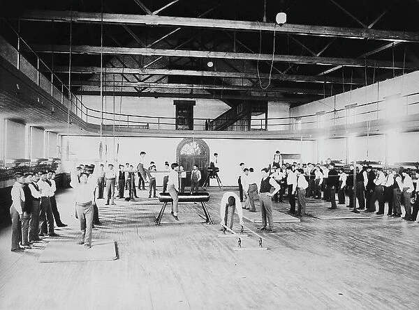 Male Native American students in physical education class, Carlisle... Pennsylvania, c1901 - 1903. Creator: Frances Benjamin Johnston
