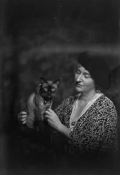 Malvina Hoffman with cat, portrait photograph, 1933 June 27. Creator: Arnold Genthe