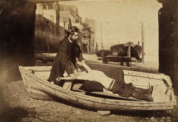 Framed Print : A man and a boy with bare torso in a rowing boat grounded on a beach... c1860s. Creator: Unknown Framed Print : A man and a boy with bare torso in a rowing boat grounded on a beach... c1860s. Creator: Unknown