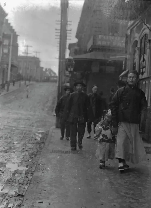 Framed Print : Man and a boy walking down a sidewalk with other people, Chinatown, San Francisco, c1896-1906. Creator: Arnold Genthe Framed Print : Man and a boy walking down a sidewalk with other people, Chinatown, San Francisco, c1896-1906. Creator: Arnold Genthe