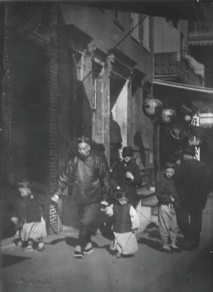 Man and two boys walking along a street, Chinatown, San Francisco, between 1896 and 1906. Creator: Arnold Genthe