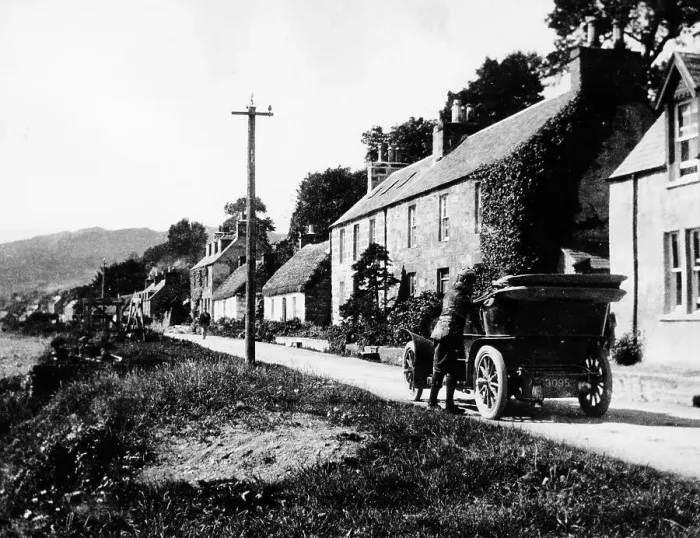 Framed Print : A man by his car in a village lane, 1900 Framed Print : A man by his car in a village lane, 1900