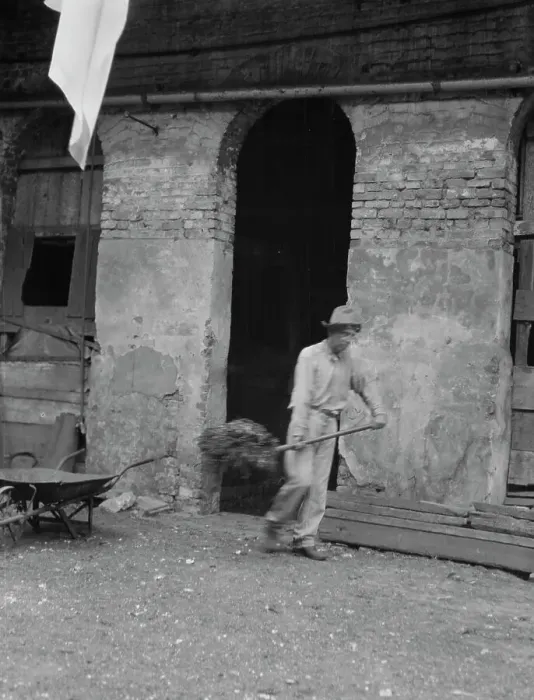 Framed Print : Man cleaning out a small building, New Orleans or Charleston, South Carolina, between 1920 and 1926. Creator: Arnold Genthe Framed Print : Man cleaning out a small building, New Orleans or Charleston, South Carolina, between 1920 and 1926. Creator: Arnold Genthe