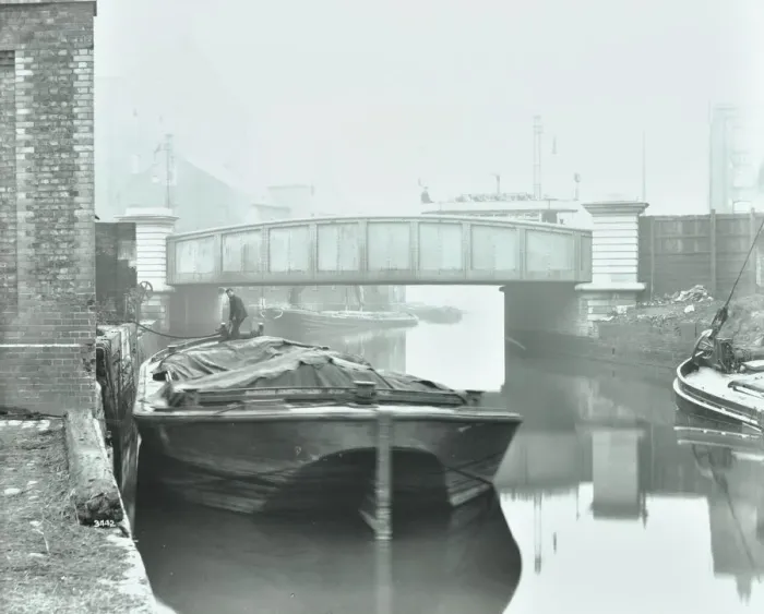 Framed Print : Man mooring a barge by a river bank, Poplar, London, 1905 Framed Print : Man mooring a barge by a river bank, Poplar, London, 1905