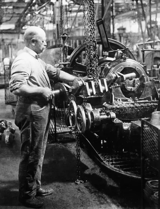 Framed Print : Man operating machinery in a car factory Framed Print : Man operating machinery in a car factory