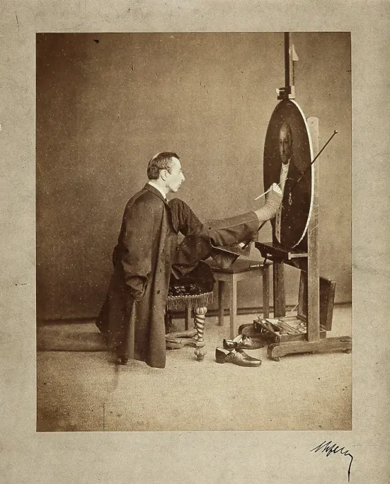 Framed Print : A man painting an oval portrait using his feet, c1870. Creator: Joseph Dupont Framed Print : A man painting an oval portrait using his feet, c1870. Creator: Joseph Dupont